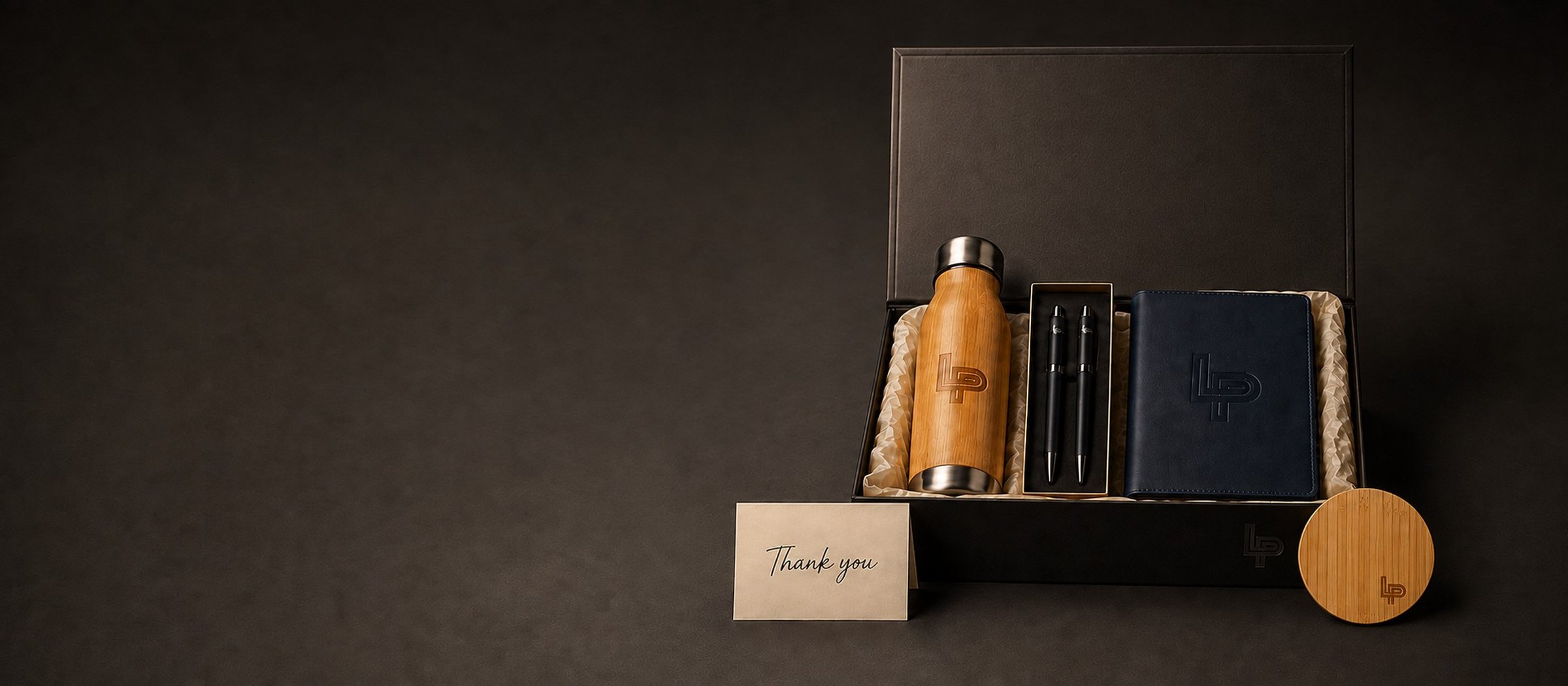 Client Appreciation: Engraved bottle · Pen set · Journal · Gift box