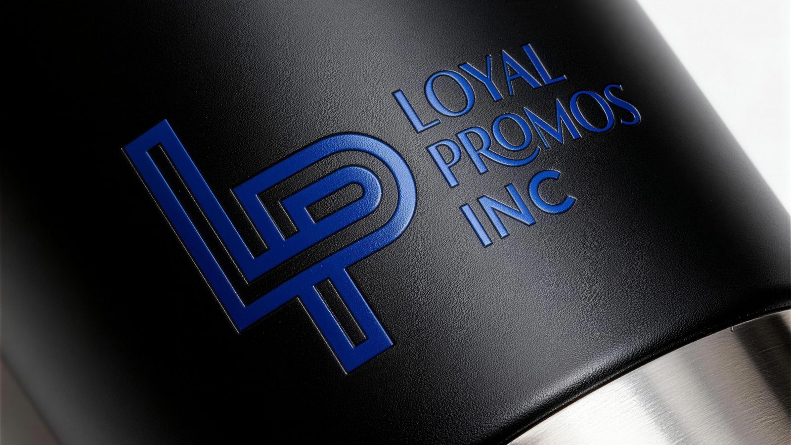 Laser-engraved logo on a matte black insulated tumbler