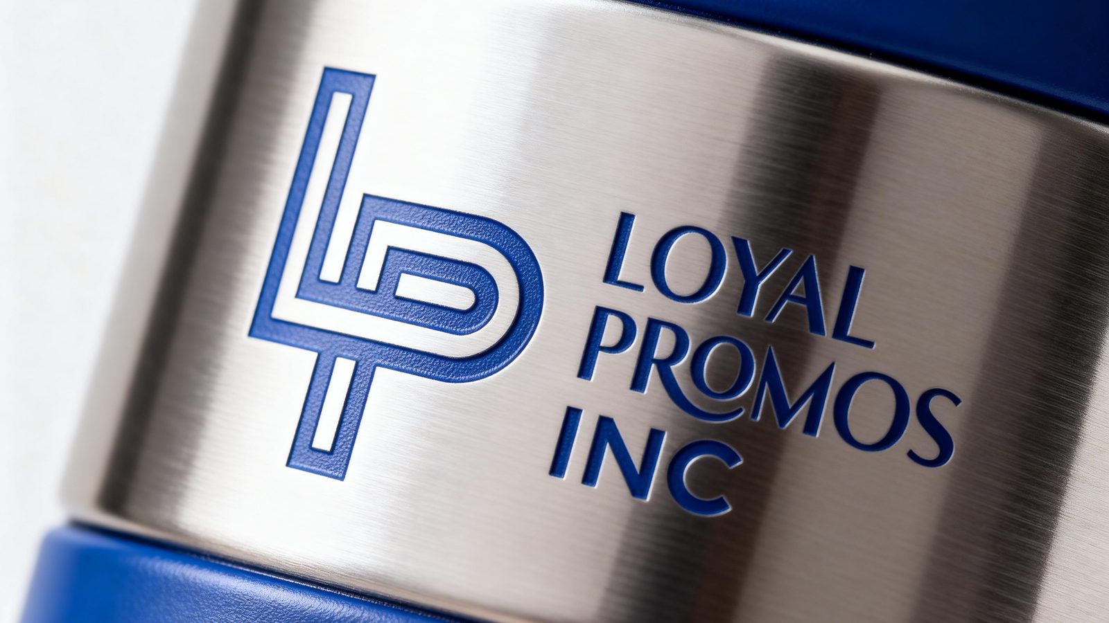 Laser-engraved logo on the stainless band of a blue insulated bottle