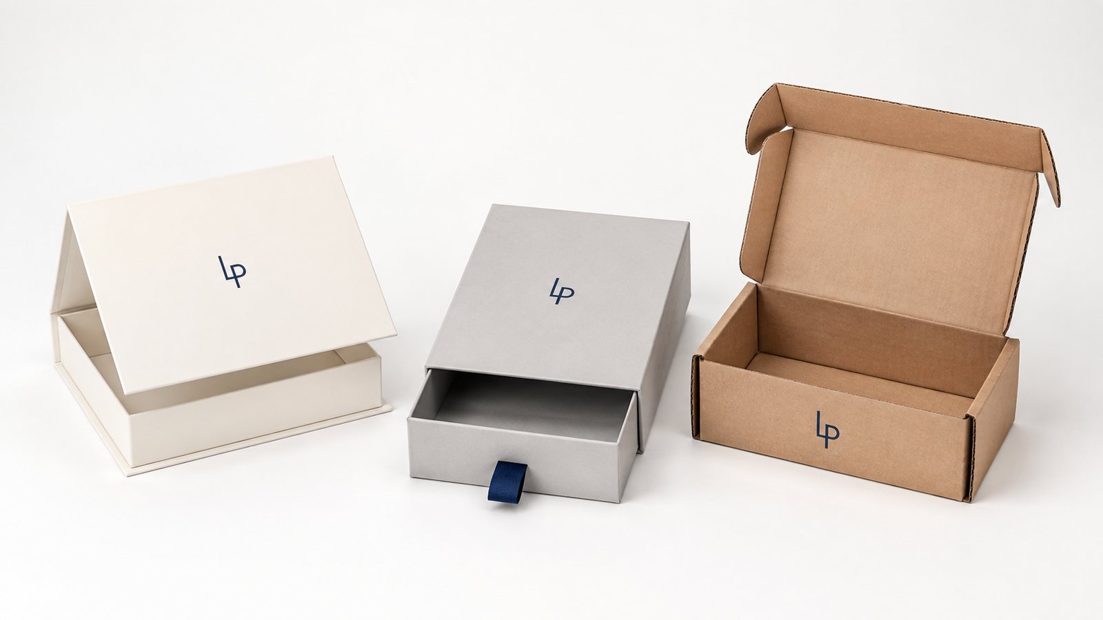Three packaging formats side by side: a rigid magnetic box, a drawer box with a ribbon pull and a printed kraft mailer
